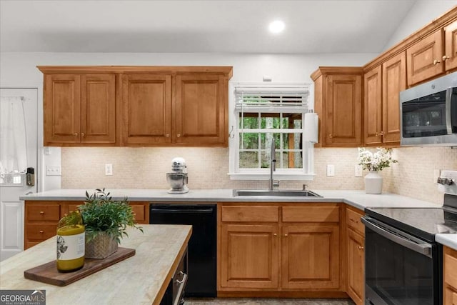 205 River Flow Dr, Dahlonega, GA 30533 - kitchen with black appliances, light countertops, and backsplash