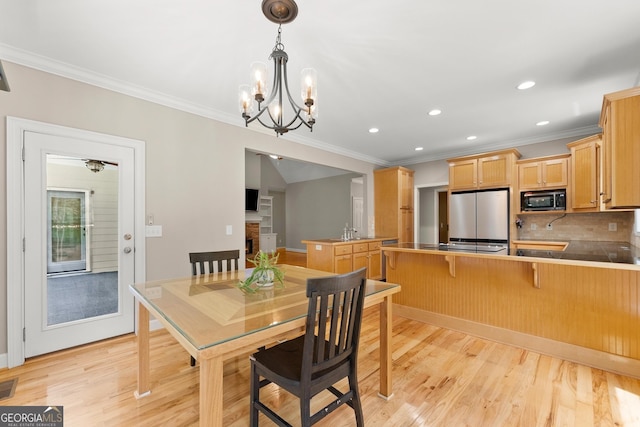 379 Sweetwater Rdg, Hoschton, GA 30548 - dining room featuring crown molding, light wood-type flooring, recessed lighting, and a chandelier