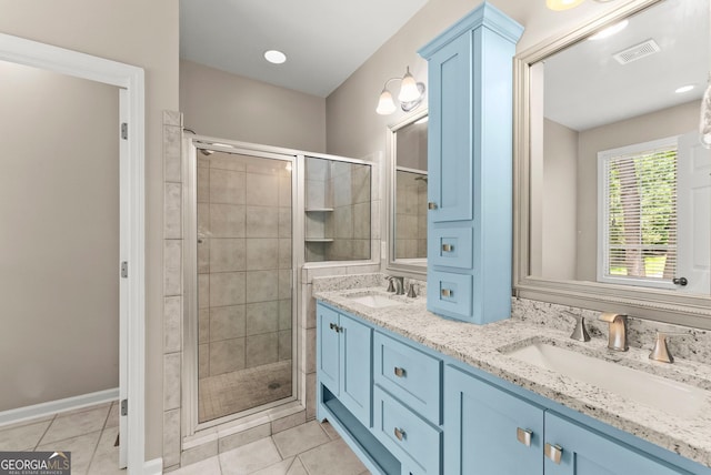379 Sweetwater Rdg, Hoschton, GA 30548 - bathroom featuring a stall shower, tile patterned flooring, and double vanity