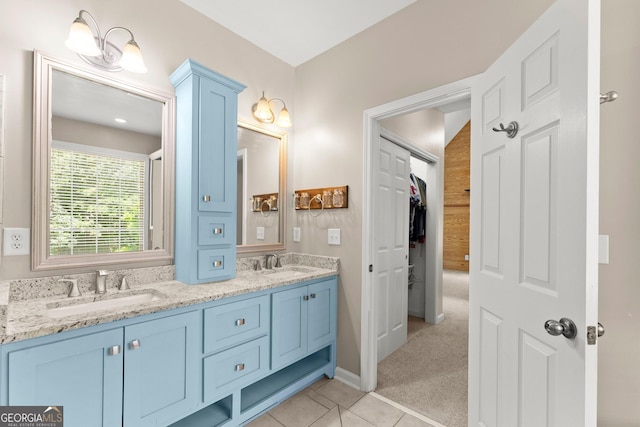 379 Sweetwater Rdg, Hoschton, GA 30548 - full bathroom featuring double vanity, tile patterned flooring, and a spacious closet