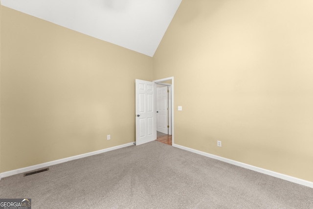 379 Sweetwater Rdg, Hoschton, GA 30548 - empty room with carpet floors and high vaulted ceiling