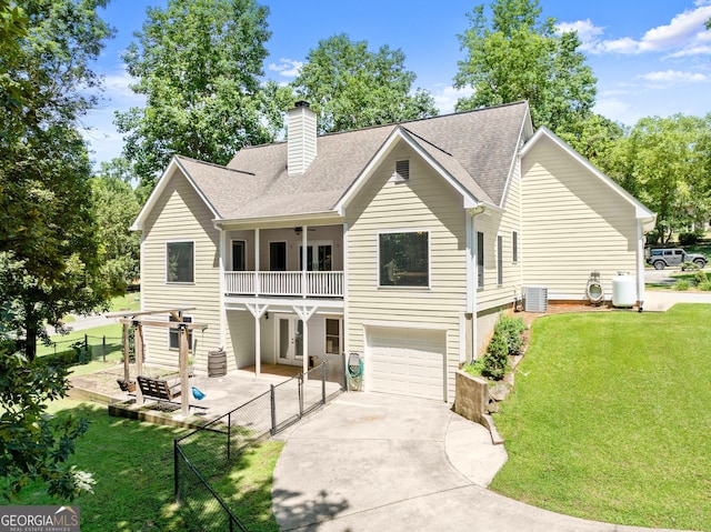 379 Sweetwater Rdg, Hoschton, GA 30548 - view of front facade with a balcony, a chimney, concrete driveway, and a shingled roof