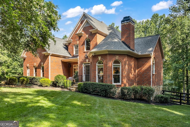 110 Wellington Way, Canton, GA 30115 - view of front facade with brick siding, roof with shingles, and a chimney