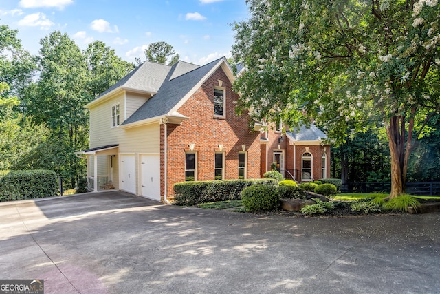 110 Wellington Way, Canton, GA 30115 - traditional-style home featuring brick siding, asphalt driveway, an attached garage, and roof with shingles