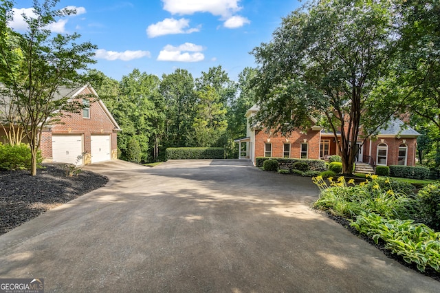 110 Wellington Way, Canton, GA 30115 - view of front of home with brick siding, driveway, and a garage