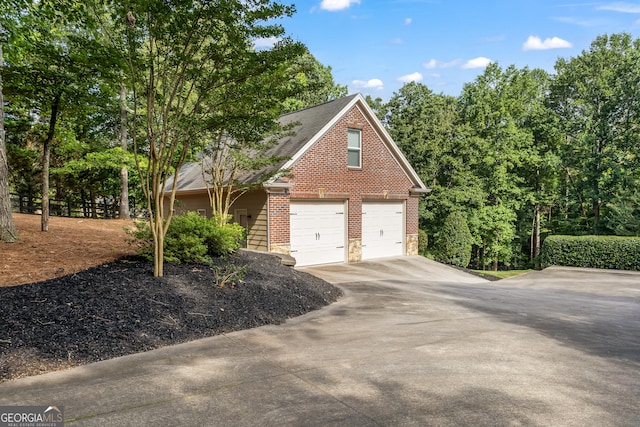 110 Wellington Way, Canton, GA 30115 - view of side of home with driveway, brick siding, roof with shingles, and stone siding