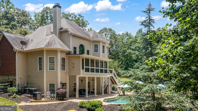 110 Wellington Way, Canton, GA 30115 - rear view of property featuring a sunroom, a patio, a chimney, an outdoor pool, and stairway