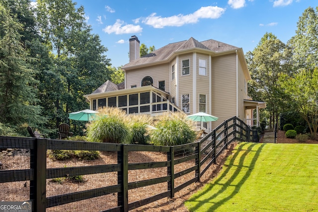110 Wellington Way, Canton, GA 30115 - back of property with a sunroom and a chimney