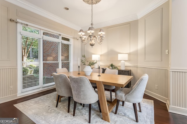 110 Wellington Way, Canton, GA 30115 - dining area featuring a decorative wall, a chandelier, wood finished floors, crown molding, and a wainscoted wall