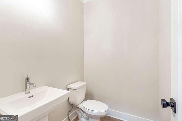 148 Palm St, Holly Springs, GA 30115 - bathroom featuring baseboards and toilet