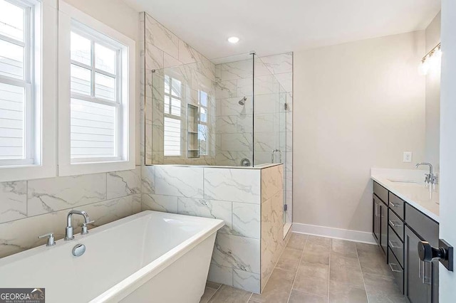 148 Palm St, Holly Springs, GA 30115 - full bathroom with a freestanding tub, a stall shower, plenty of natural light, double vanity, and recessed lighting