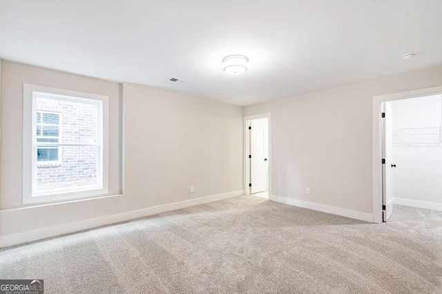 148 Palm St, Holly Springs, GA 30115 - unfurnished room with baseboards and light carpet