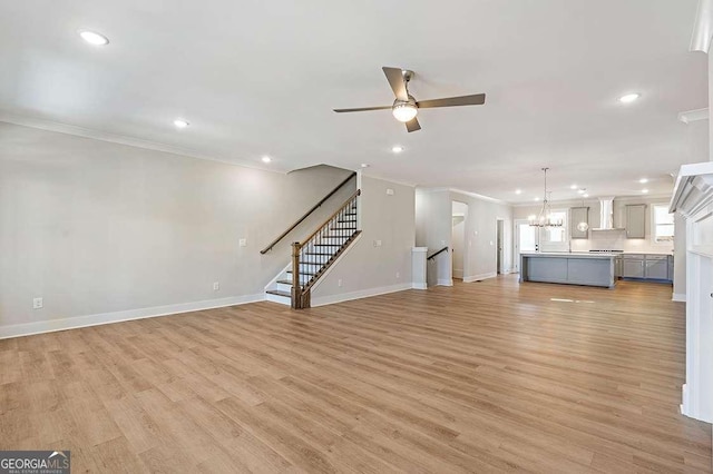 148 Palm St, Holly Springs, GA 30115 - unfurnished living room with ornamental molding, ceiling fan, recessed lighting, light wood finished floors, and stairway