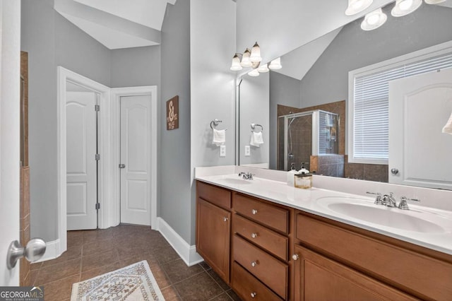 43 Emily Ln, Bogart, GA 30622 - full bathroom with a shower stall, double vanity, tile patterned flooring, and vaulted ceiling