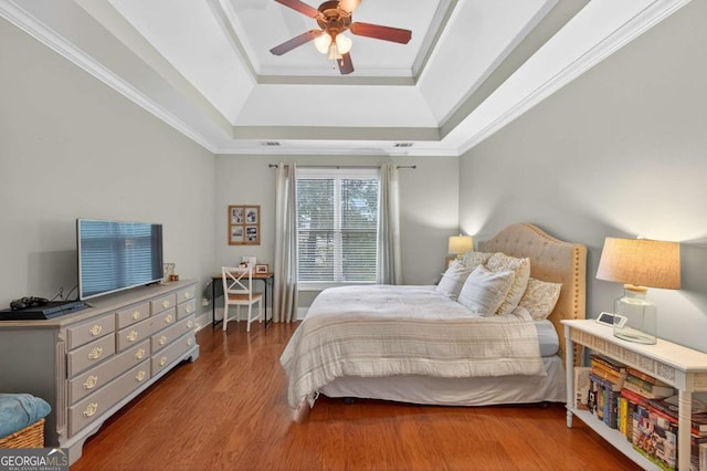 43 Emily Ln, Bogart, GA 30622 - bedroom featuring a raised ceiling, wood finished floors, a ceiling fan, and ornamental molding