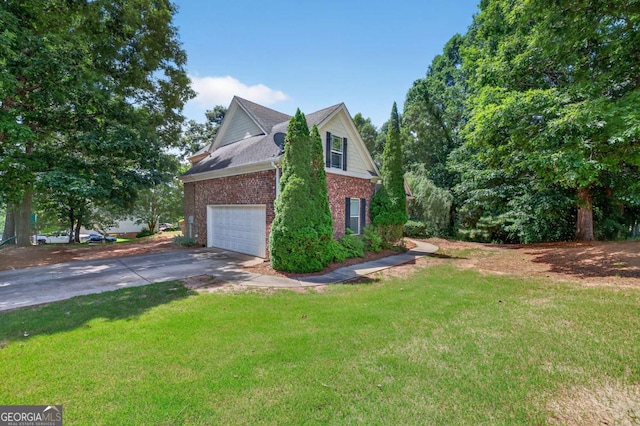 43 Emily Ln, Bogart, GA 30622 - view of side of property with brick siding, driveway, a lawn, and a garage