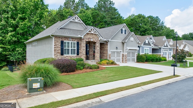 1071 Creekwood Cir, Madison, GA 30650 - craftsman-style house with stone siding, concrete driveway, a front lawn, and an attached garage