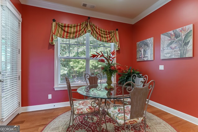 1071 Creekwood Cir, Madison, GA 30650 - dining space with ornamental molding and wood finished floors