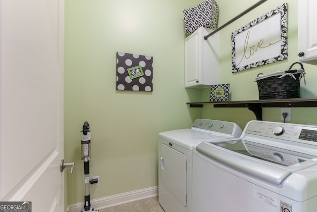 1071 Creekwood Cir, Madison, GA 30650 - washroom featuring cabinet space, washer and dryer, and light tile patterned floors