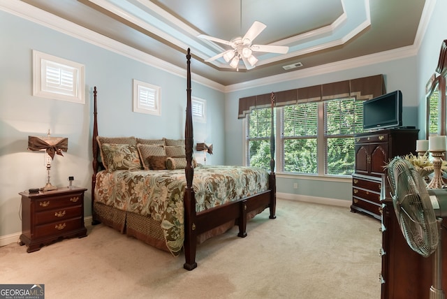 1071 Creekwood Cir, Madison, GA 30650 - bedroom featuring light carpet, crown molding, a raised ceiling, and a ceiling fan