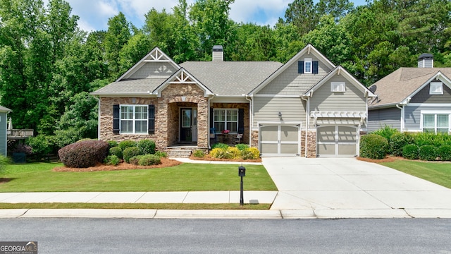 1071 Creekwood Cir, Madison, GA 30650 - craftsman inspired home with concrete driveway, stone siding, a front yard, a chimney, and a garage