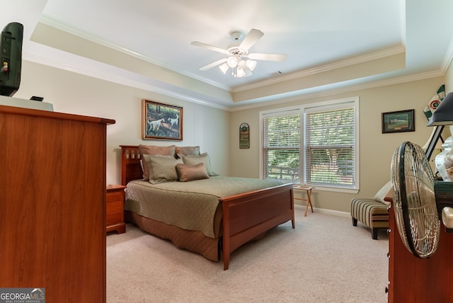 1071 Creekwood Cir, Madison, GA 30650 - bedroom with light colored carpet, ornamental molding, a tray ceiling, and a ceiling fan