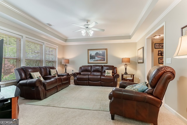 1071 Creekwood Cir, Madison, GA 30650 - carpeted living room featuring ceiling fan, ornamental molding, and a raised ceiling