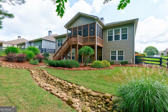 1071 Creekwood Cir, Madison, GA 30650 - back of property with a sunroom and stairway