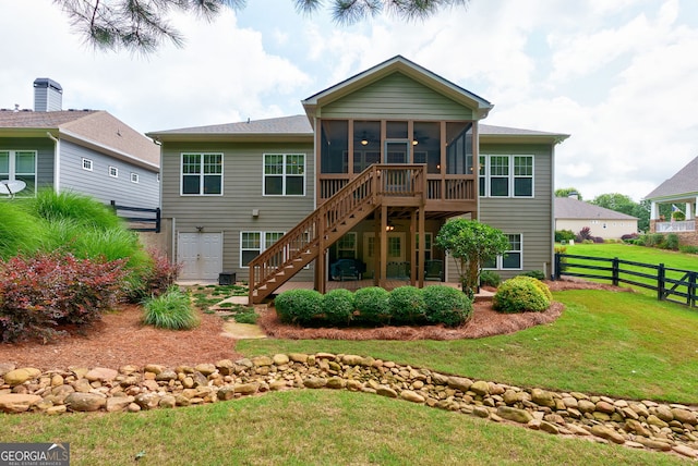 1071 Creekwood Cir, Madison, GA 30650 - rear view of house featuring a sunroom and stairway