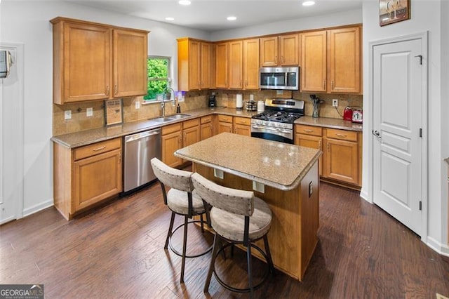 109 Hale View Cir, Canton, GA 30114 - kitchen with stainless steel appliances, recessed lighting, a kitchen island, backsplash, and dark wood-type flooring
