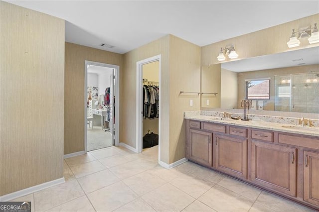 109 Hale View Cir, Canton, GA 30114 - bathroom featuring double vanity, a shower stall, a spacious closet, and tile patterned floors