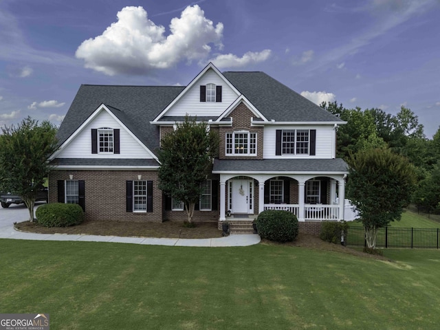 481 Fields Ferry Dr NE, Calhoun, GA 30701 - traditional-style house with covered porch, brick siding, and a shingled roof