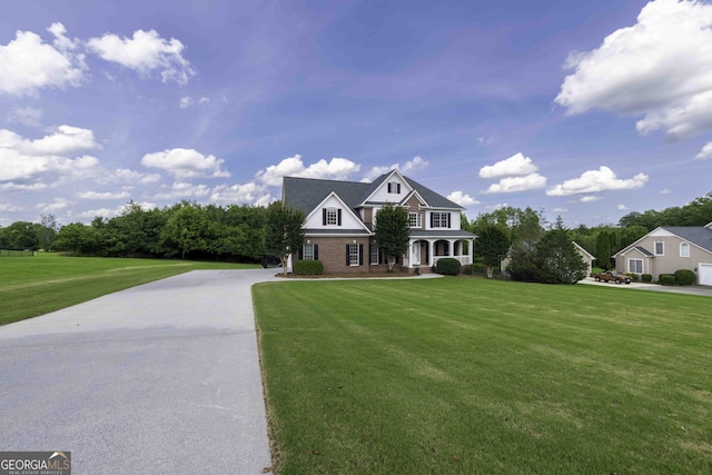 481 Fields Ferry Dr NE, Calhoun, GA 30701 - view of front of home with a front lawn, driveway, and covered porch