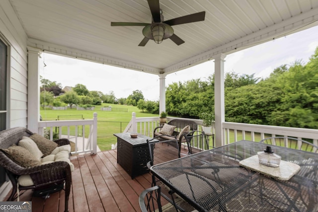 481 Fields Ferry Dr NE, Calhoun, GA 30701 - wooden deck featuring outdoor dining area, a ceiling fan, a lawn, and an outdoor living space
