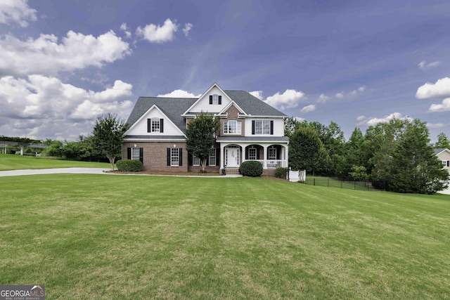 481 Fields Ferry Dr NE, Calhoun, GA 30701 - traditional-style home featuring a porch and brick siding