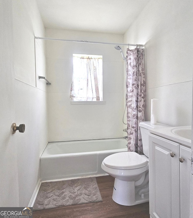 1055 Scruggs Cir, Bartow, GA 30413 - full bath with shower / tub combo with curtain, wood finished floors, and vanity