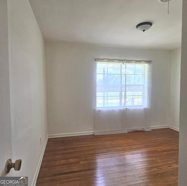 1055 Scruggs Cir, Bartow, GA 30413 - spare room with dark wood-type flooring and baseboards