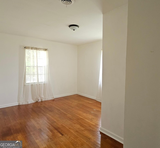 1055 Scruggs Cir, Bartow, GA 30413 - unfurnished room featuring wood finished floors and baseboards