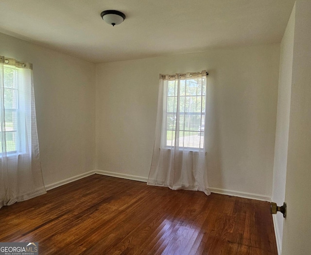 1055 Scruggs Cir, Bartow, GA 30413 - empty room with dark wood-style floors and baseboards