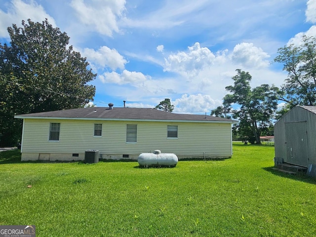 1055 Scruggs Cir, Bartow, GA 30413 - back of property with crawl space, a shed, and a yard