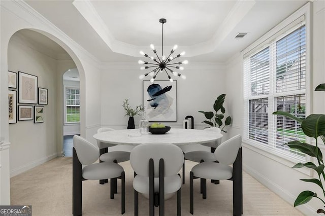 3366 Bridge Walk Dr, Lawrenceville, GA 30044 - dining area featuring arched walkways, a chandelier, a raised ceiling, and crown molding