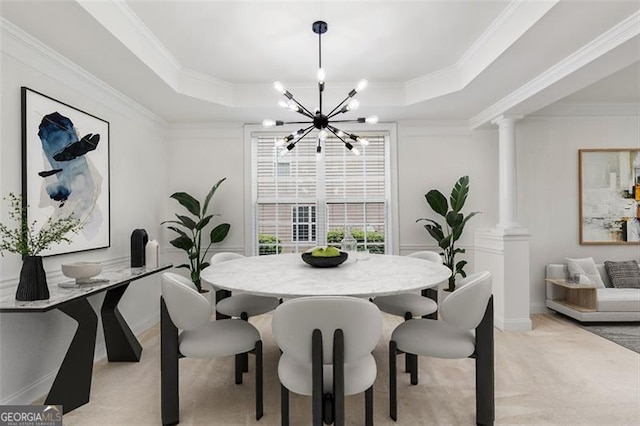 3366 Bridge Walk Dr, Lawrenceville, GA 30044 - dining space featuring a tray ceiling, a chandelier, light colored carpet, crown molding, and ornate columns