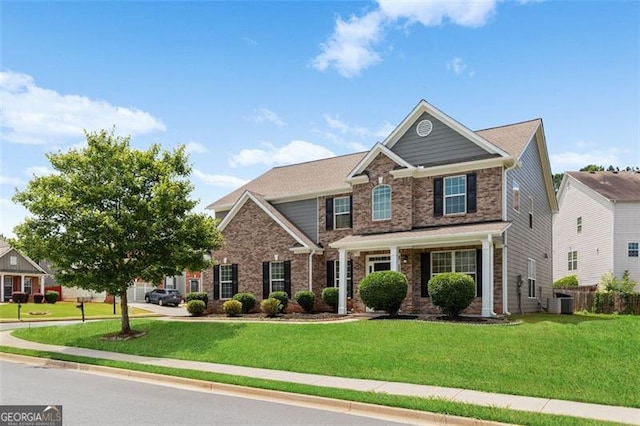 3366 Bridge Walk Dr, Lawrenceville, GA 30044 - craftsman-style home with a front lawn and brick siding