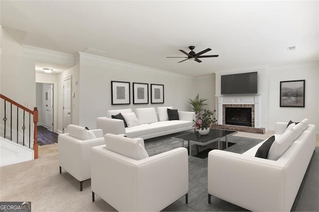 3366 Bridge Walk Dr, Lawrenceville, GA 30044 - living area featuring a ceiling fan, crown molding, stairway, and a brick fireplace