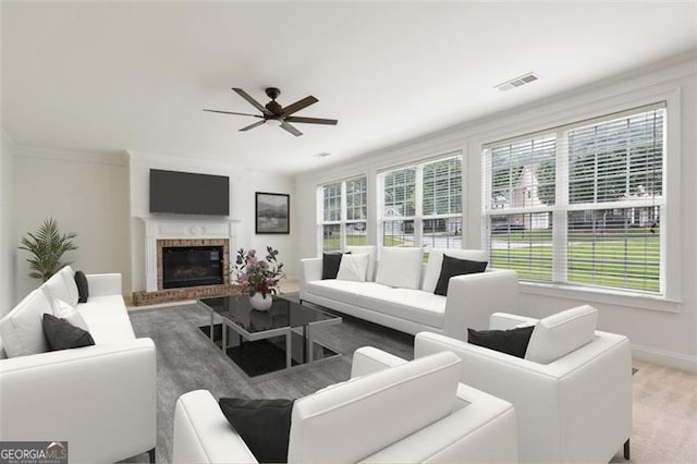 3366 Bridge Walk Dr, Lawrenceville, GA 30044 - living room featuring healthy amount of natural light, a ceiling fan, and a fireplace