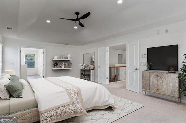 3366 Bridge Walk Dr, Lawrenceville, GA 30044 - bedroom with light carpet, recessed lighting, a tray ceiling, and a ceiling fan