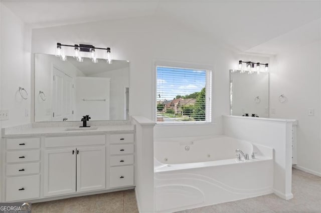 3366 Bridge Walk Dr, Lawrenceville, GA 30044 - bathroom featuring a whirlpool tub, vanity, and tile patterned flooring