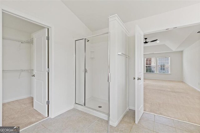3366 Bridge Walk Dr, Lawrenceville, GA 30044 - bathroom featuring a shower stall, a spacious closet, and tile patterned floors