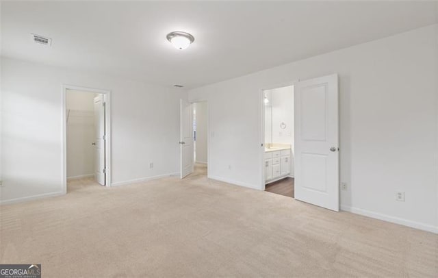 3366 Bridge Walk Dr, Lawrenceville, GA 30044 - unfurnished bedroom featuring light colored carpet, a spacious closet, ensuite bath, and a closet