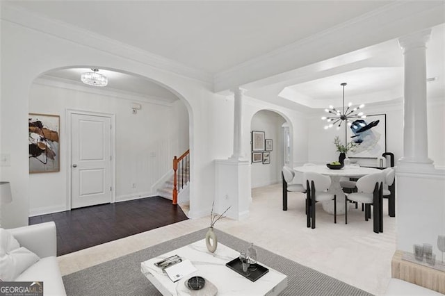 3366 Bridge Walk Dr, Lawrenceville, GA 30044 - living area featuring a chandelier, arched walkways, stairway, and ornamental molding